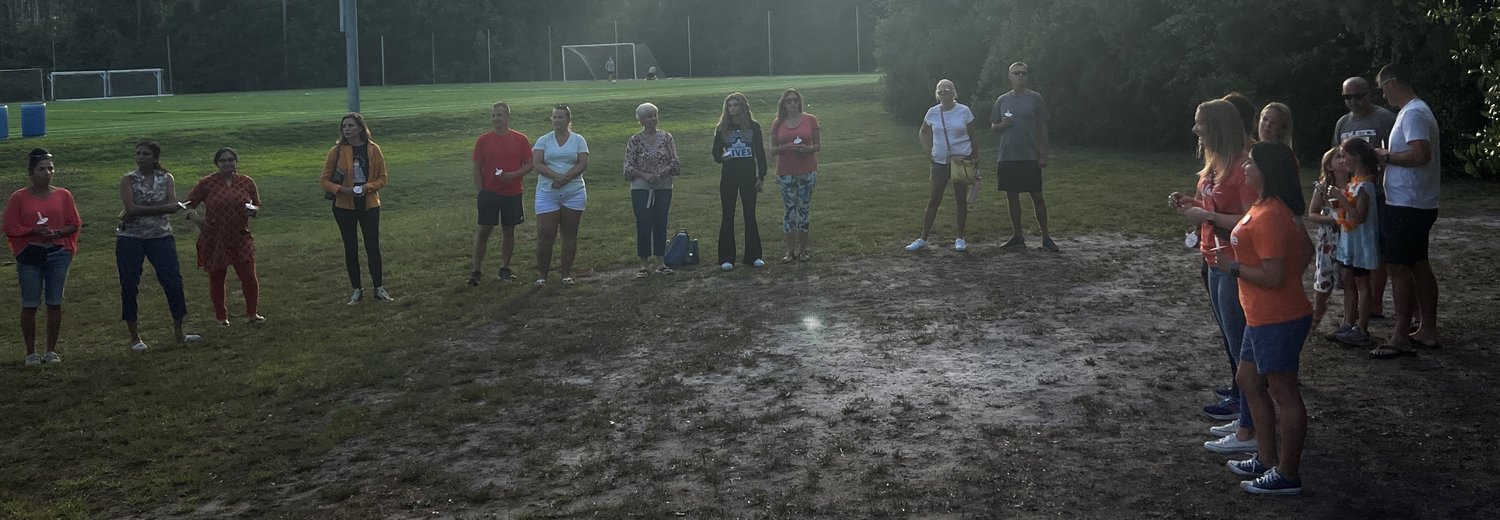 Area residents gathered at Davis Park on May 31 for a candlelight vigil following the recent shootings in Uvalde, Texas, and Buffalo, New York.